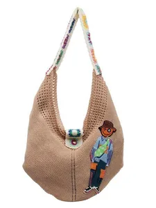 Chic knit hobo bag in khaki with a colorful patterned strap and cute cartoon embroidery