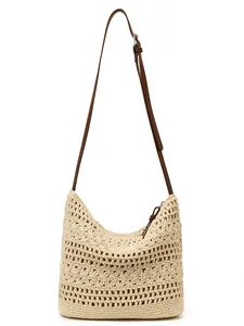 Large beige hand-woven crochet shoulder bag with floral patterns and brown strap