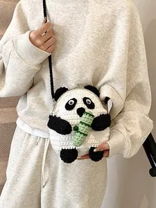 Handmade panda crochet crossbody bag with metal clasp closure and black woven strap