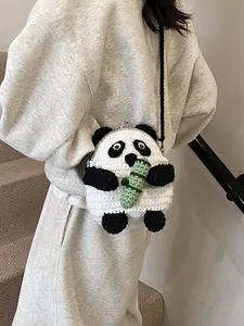 Handmade crochet panda crossbody bag with metal clasp and bamboo detail for women
