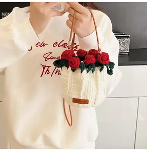 Detail of hand-made crochet rose bucket bag with leather strap and craft label