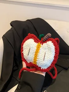 Handmade knitted apple shaped crossbody bag for kids with red yarn shoulder strap