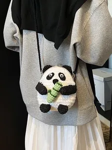 Handmade crochet panda crossbody bag for women with green bamboo detail and woven strap