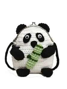 Handmade crochet panda shoulder bag with silver metal clasp and green bamboo detail