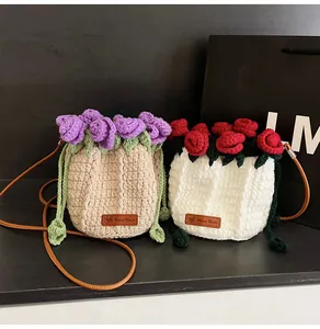 Macro detail of hand-crocheted rose bucket bags with leather strap and handmade label