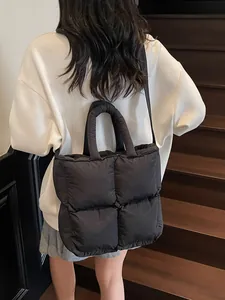 Black quilted down cotton tote bag with large capacity for women on model back