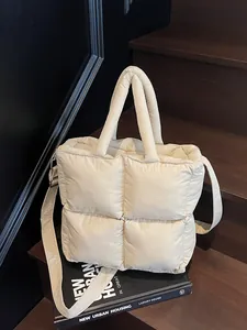 Off-white quilted puffer handbag with square pattern and adjustable shoulder strap