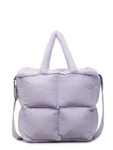 Light purple quilted puffer tote bag with large square stitching and adjustable strap