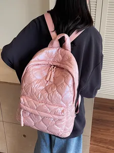 Pink quilted down-filled nylon backpack for women featuring a spacious lightweight design