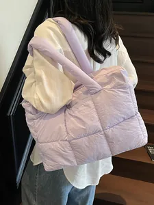 Quilted lavender tote bag with puffer design and wide shoulder strap for casual wear
