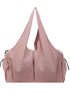 Pink minimalist pleated nylon shoulder bag with side drawstring pockets and large capacity