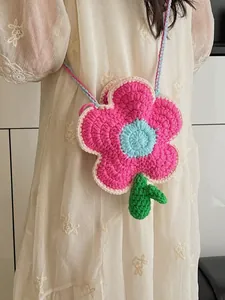 Handmade crochet flower crossbody bag in pink and green for women with woven strap