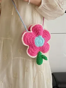 Handmade crochet flower crossbody bag in pink and blue wool for a cute aesthetic