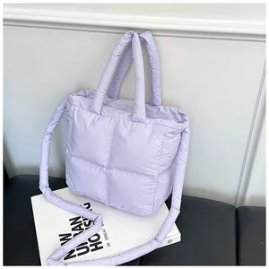 Close-up of lilac quilted puffer tote bag with soft padded texture and dual straps