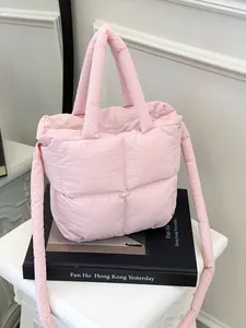 Pink quilted puffer bag for women with short handles and adjustable long shoulder strap