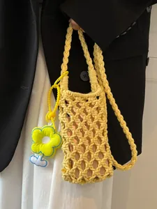 Yellow hand-woven hollow knit crossbody phone bag with sunflower charm for beach vacation