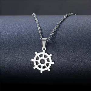 Classic silver stainless steel nautical helm pendant necklace on a minimalist dark display