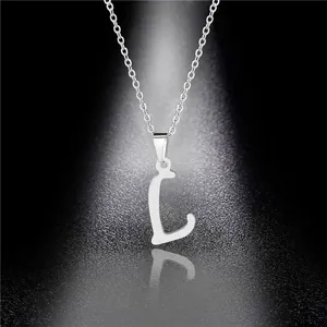 Macro shot of polished silver letter L pendant on a delicate stainless steel chain