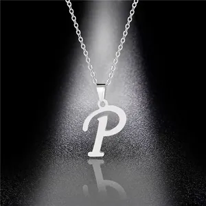 Macro detail of a polished stainless steel necklace featuring a letter P pendant with reflection