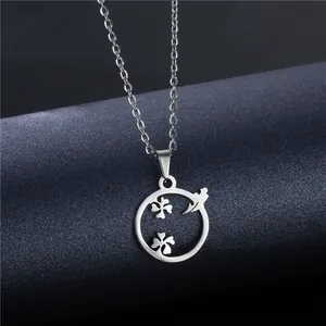 Polished stainless steel four-leaf clover necklace with airplane charm on blue background