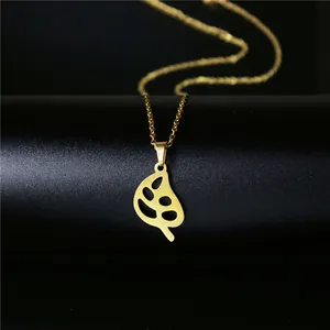 Collier élégant avec pendentif feuille de monstera dorée en acier titane poli