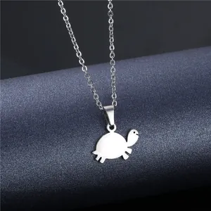 Minimalist silver turtle necklace in polished stainless steel with fine cable chain link