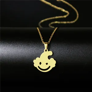 Polished gold stainless steel necklace with abstract hip hop joker pendant on black background