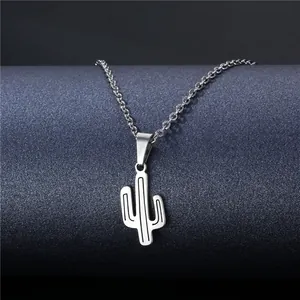 Minimalist silver stainless steel cactus pendant necklace on a modern grey display