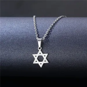 Polished silver stainless steel hexagram star pendant necklace on a blue display stand