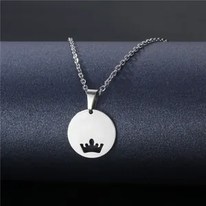 Minimalist silver-toned round pendant necklace with crown cutout on fine chain