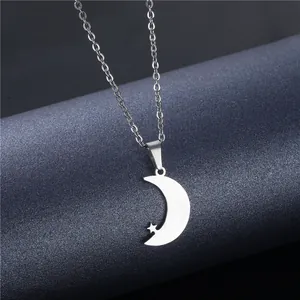 Polished silver stainless steel crescent moon and star pendant on a slim cable chain