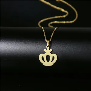Elegant gold crown pendant necklace on a black pedestal for women's jewelry