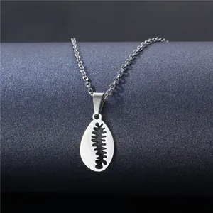 Polished titanium steel necklace with a shell-shaped pendant on a minimalist display
