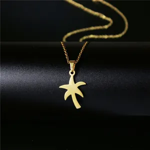 Collier bohème en acier inoxydable doré avec pendentif palmier minimaliste sur noir