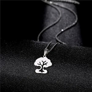 Minimalist stainless steel necklace featuring a silver tree of life pendant on black background