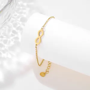 Detailed shot of infinity symbol on a gold stainless steel chain with adjustable length