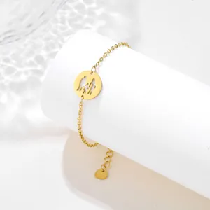 Detail of gold family silhouette pendant with father mother and kids on stainless steel chain