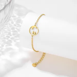 Detail of gold-plated stainless steel bracelet featuring a boy and girl silhouette pendant