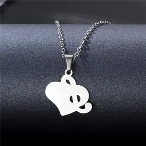 Polished stainless steel necklace featuring a hollow heart and music note pendant design
