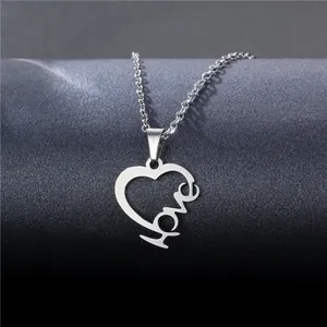 Elegant stainless steel heart necklace featuring hollow love pendant on silver cable chain