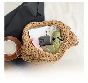 Detail show of oatmeal woven tote bag with fringe and large capacity for daily items