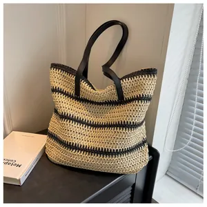 Macro shot of large bohemian woven tote bag with black and beige horizontal stripes