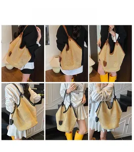 Detail view of large woven tote bags with leather straps in black and brown colors