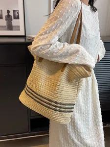 Bohemian woven tote bag with black stripes and brown straps for summer travel