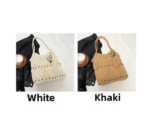 Detail of hand-woven hollow crochet tote bags in white and khaki with bead tassel