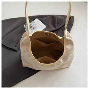Interior view of embroidered tote bag showing zipper pocket and spacious lining
