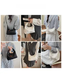 Detailed views of the minimalist handbag with tassel accent shown on a model in six angles