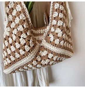 Close-up of handmade crochet tote bag with beige and brown granny square pattern and lining