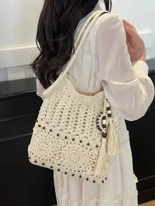 Bohemian hollow cotton woven shoulder bag with beads and tassel for beach vacations