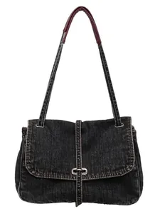 Chic vintage oversized denim crossbody bag with contrast leather strap and D-ring buckle